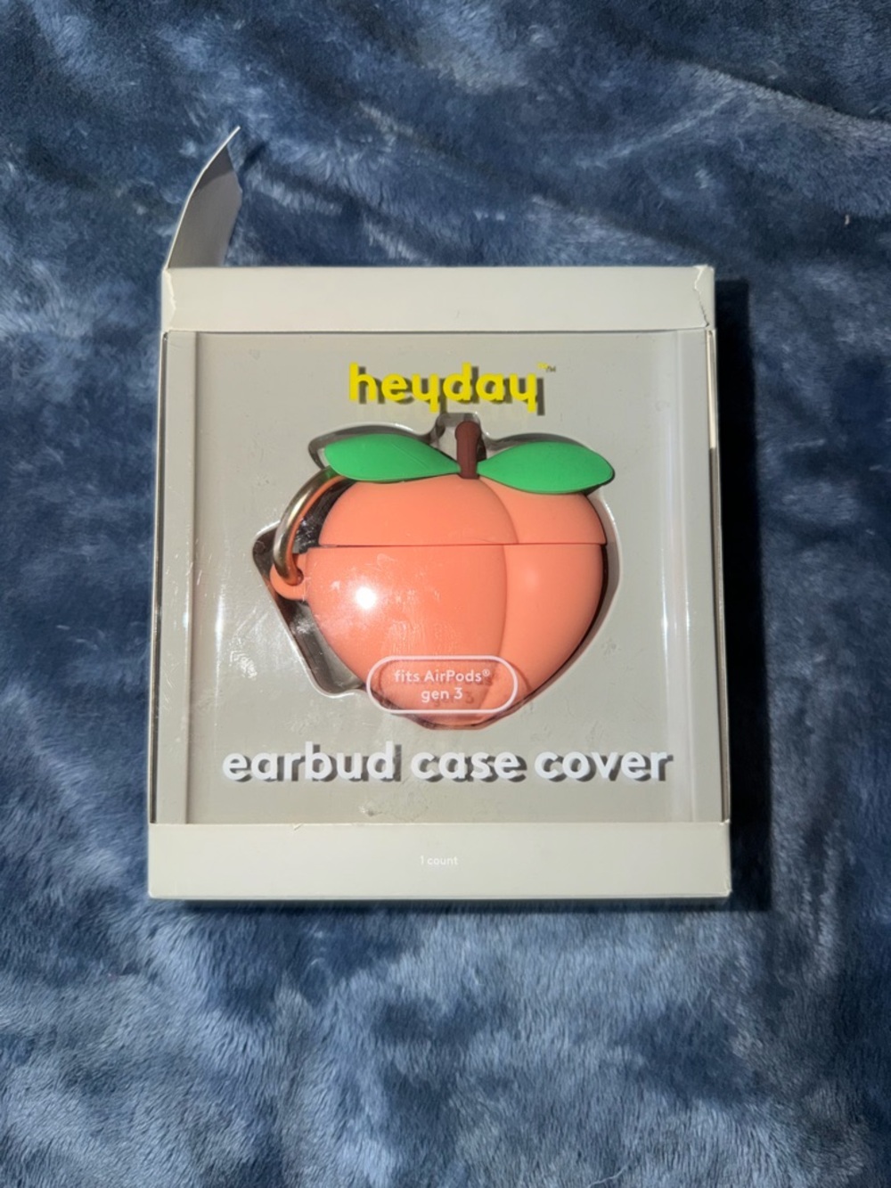 heyday Peach-Shaped Earbud Case in Coral with Green Leaves